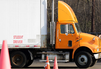 image of orange and white student driver semi truck
