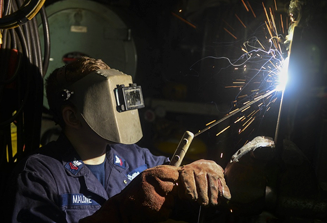 image of person welding