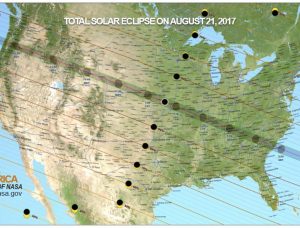 image of U.S. map showing solar eclipse path, text at top reads "total solar eclipse on August 21, 2017"