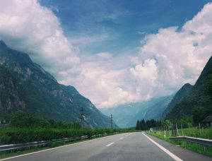 image of open road in mountains during the day
