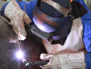 image of person welding up close
