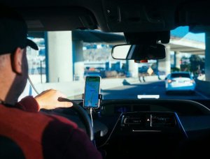 image of truck driver using his phone for directions