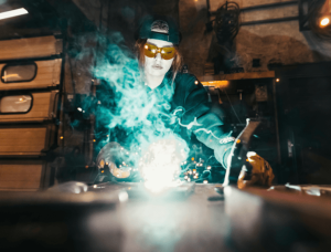 A picture of a woman welding